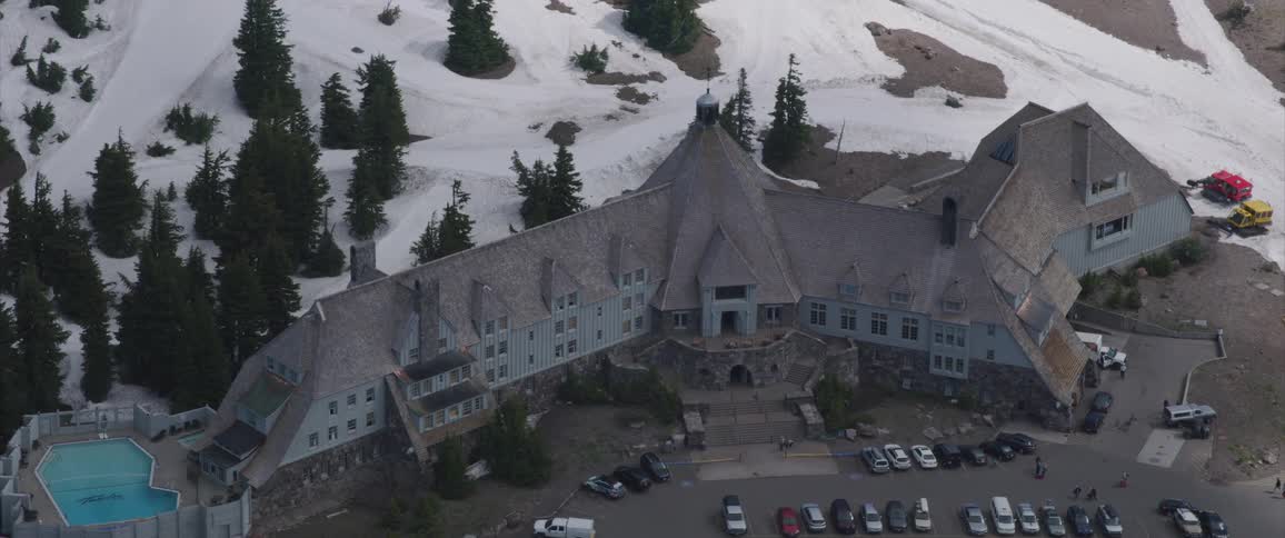 The camera flies over a ski lodge
