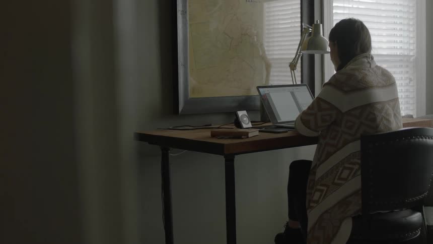 A person typing at a computer