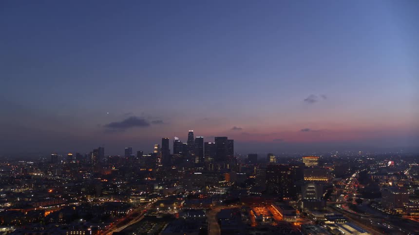 Aerial view of city skyline at dusk