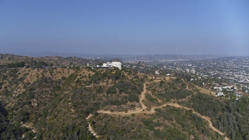 An aerial view of forests are displayed