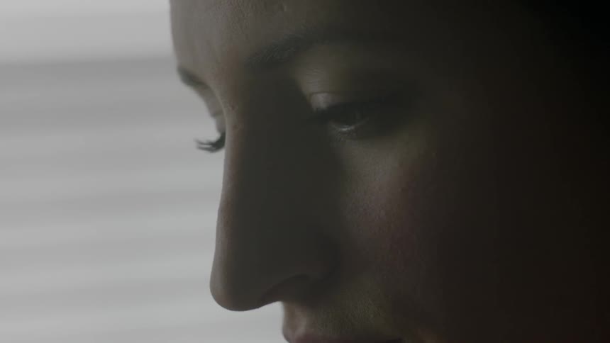 A woman blinking and concentrating