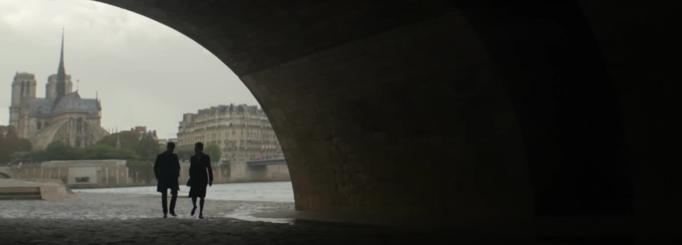 Two people walk into a tunnel