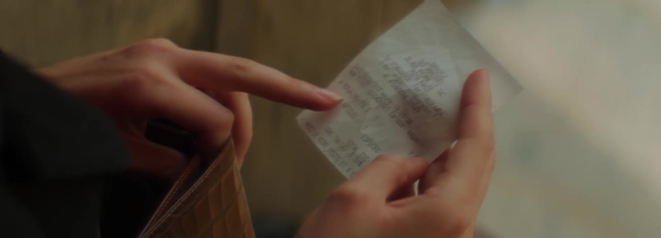 A person reading a ticket