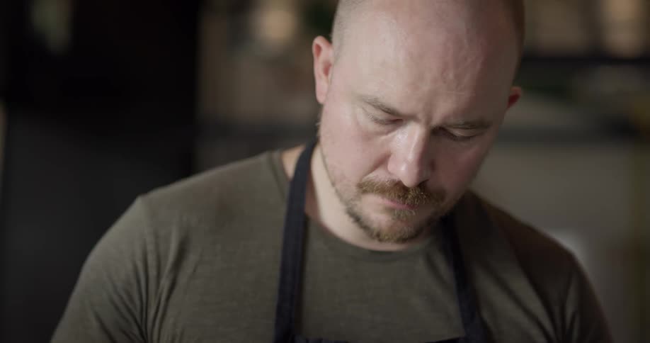 Chef cooks in kitchen