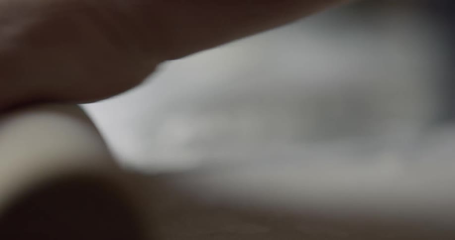 Man rolling out dough with a rolling pin