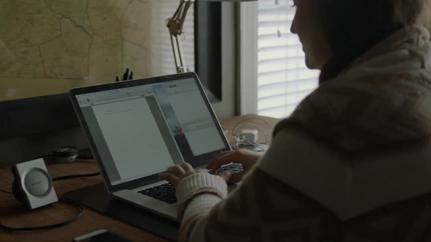 A person typing at a computer