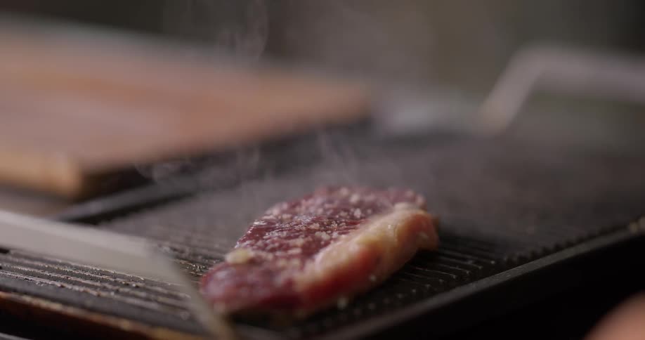 Red fatty meat cooked on the grill