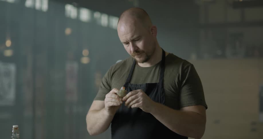 A man peeling food