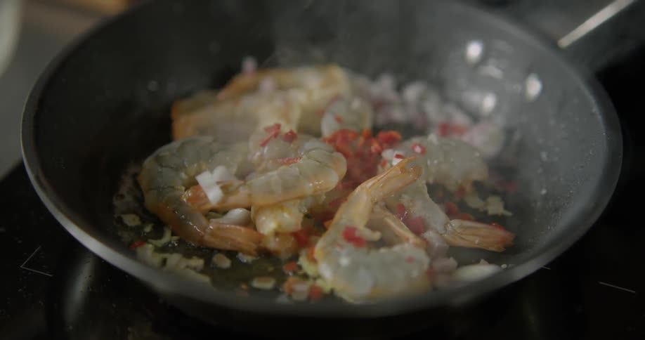 Frying shrimp in skillet