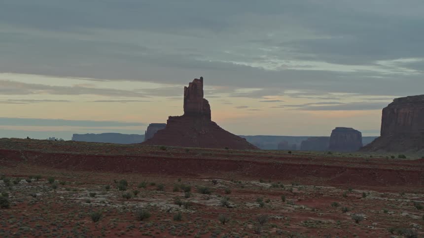 Wide shot of desert mesas at dusk