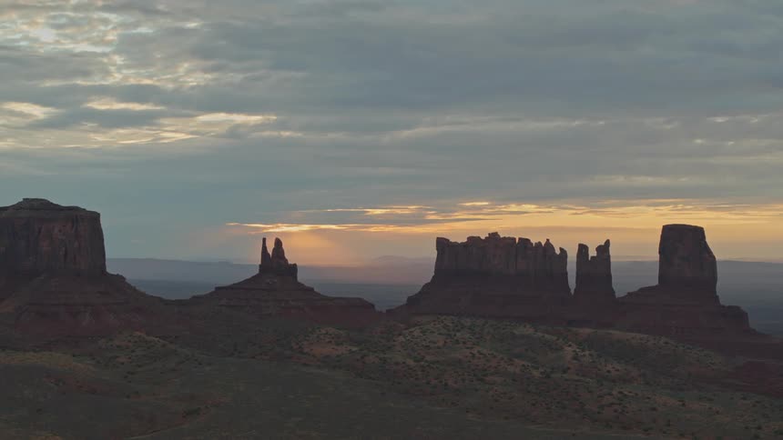 Mesas on the horizon near hills and valleys