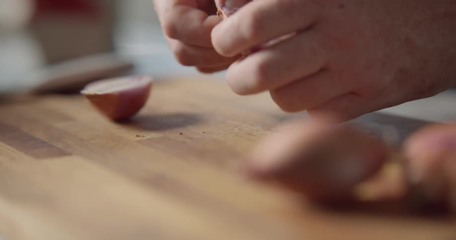 A man preparing garlic