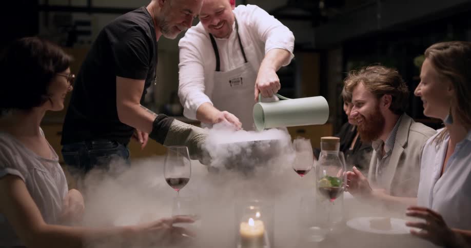 A chef making a desert at the table