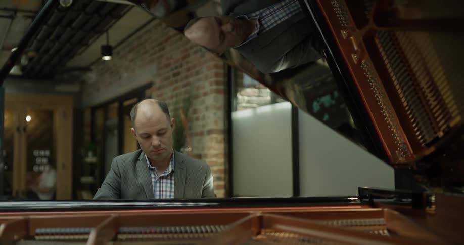 A man plays the piano