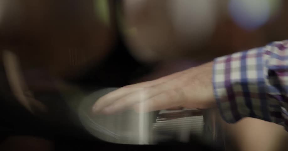 A man plays piano