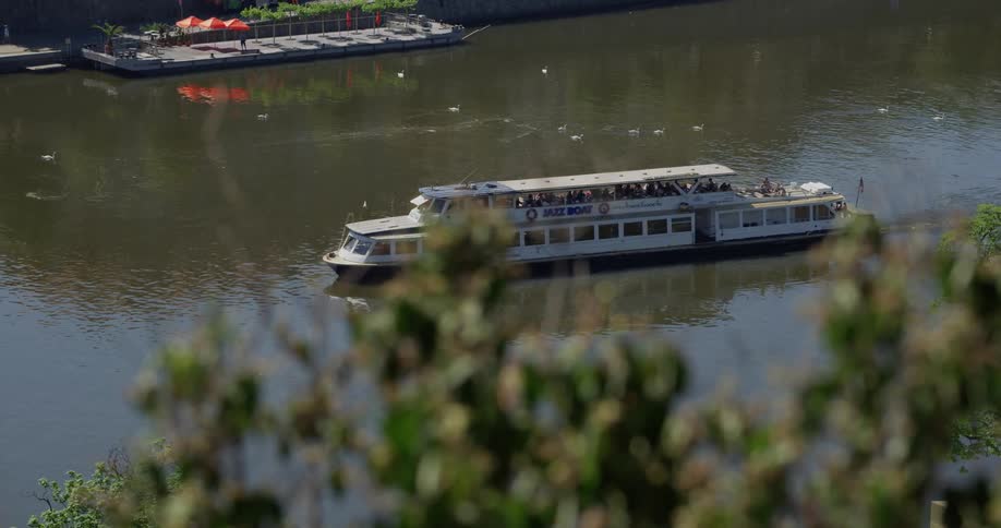 Ferry moves along river
