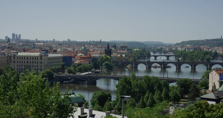 A series of bridges spanning a river in a city during the day