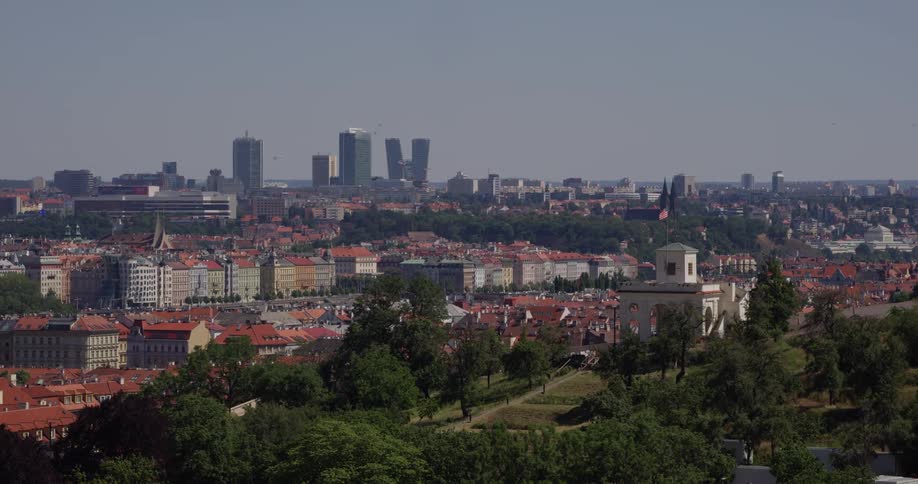 A city skyline with skyscrapers and picturesque houses and parks