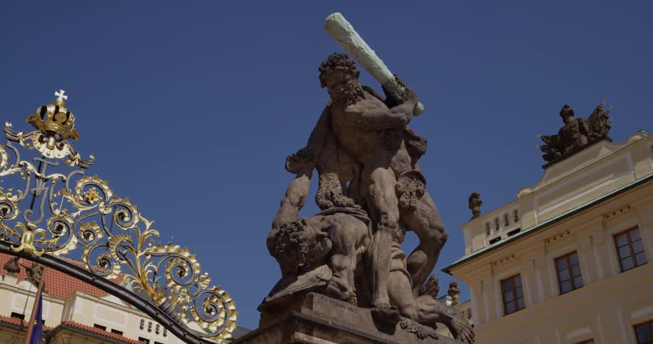 A statute of a man with a club standing over another man