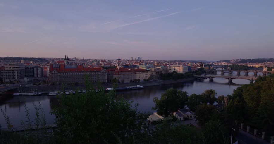 The bridge leads into the city below