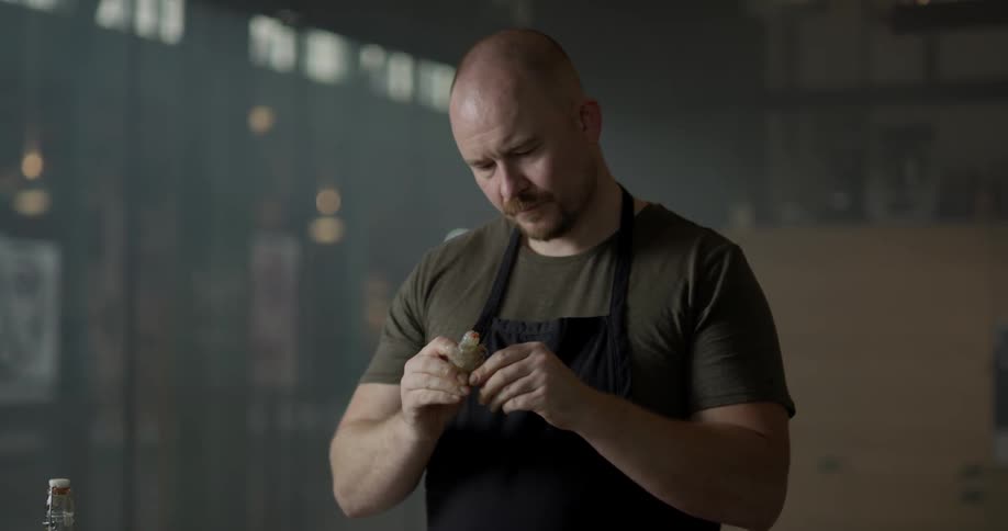 A man peels a shrimp