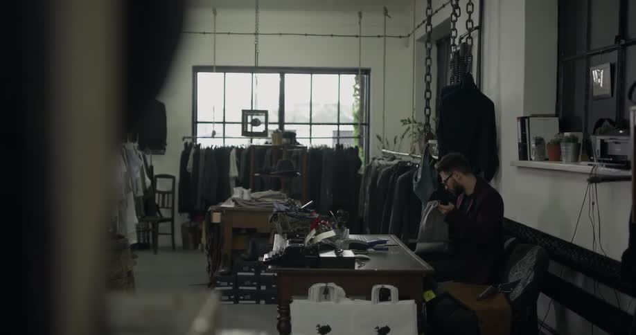 A tailor working on his shop