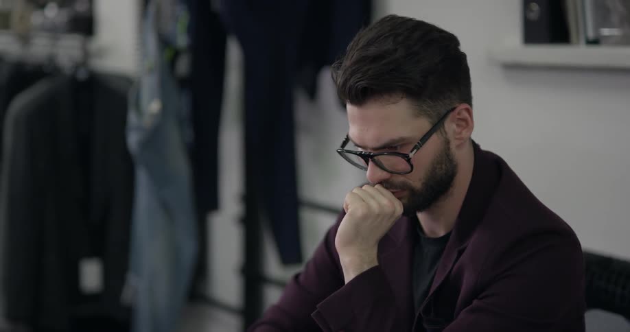 A man is looking at a laptop