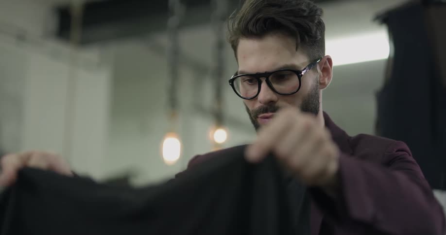 Salesman folds shirts