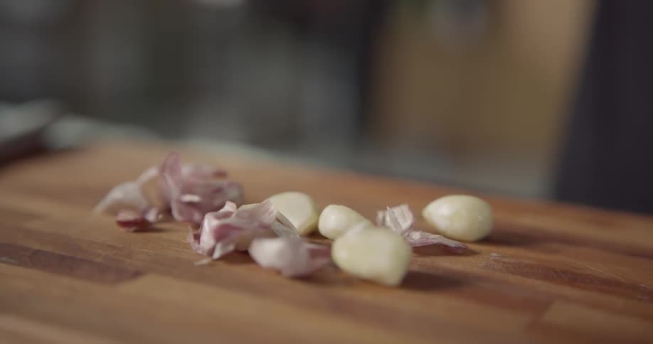 A person prepares garlic