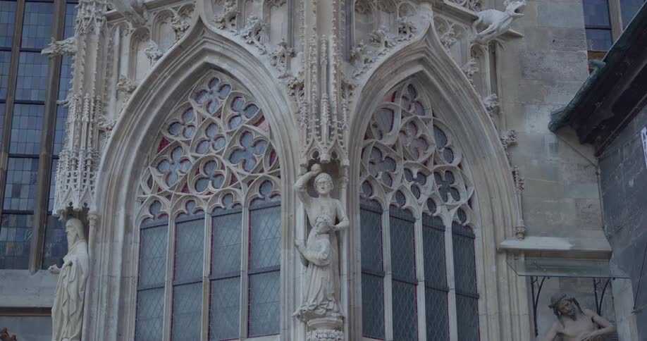 The church has stone statues near the windows