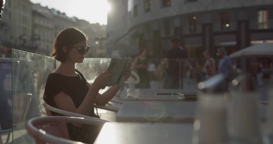 A woman is reading outdoors