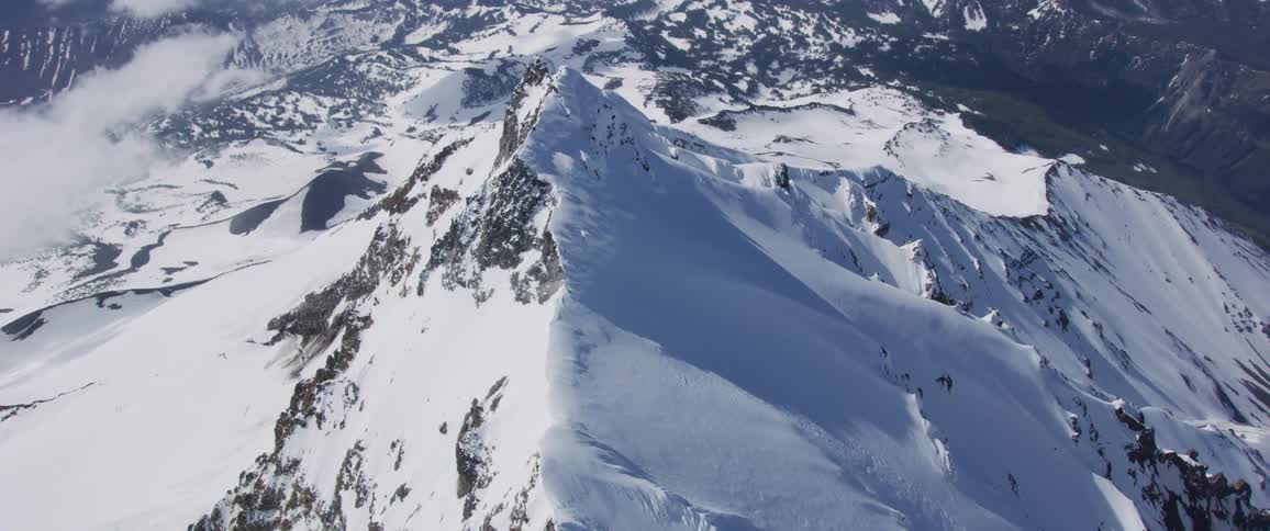 Snow covers a mountain peak