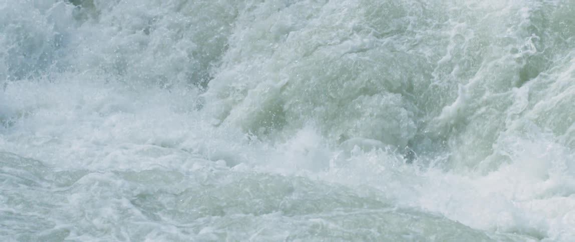Waterfall crashes into surface