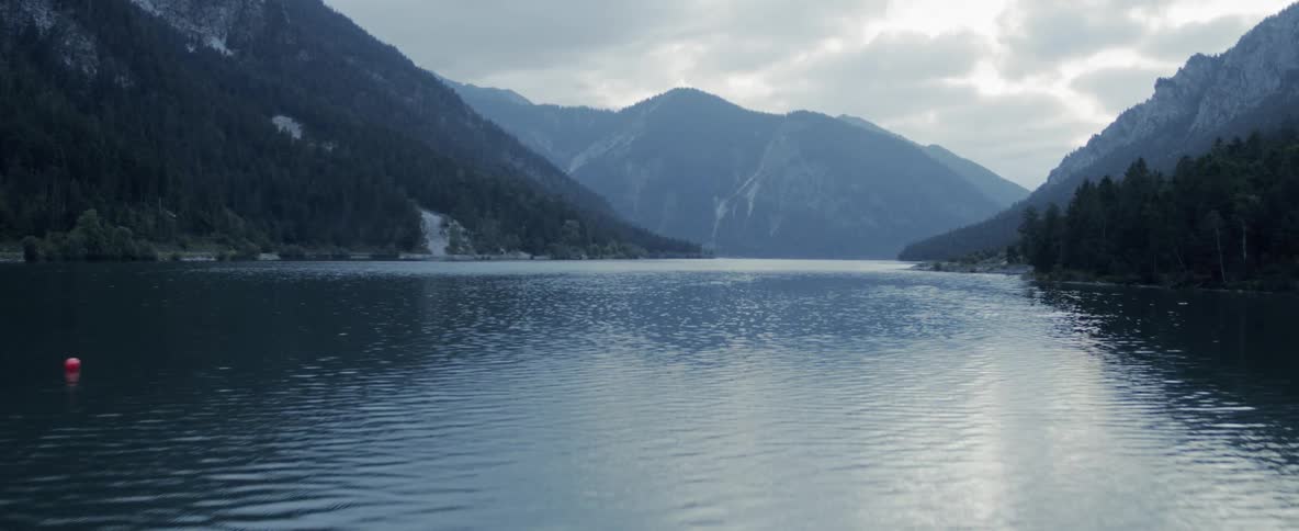 A lake sits between two mountains