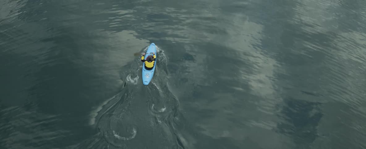 Man kayaking through a lake