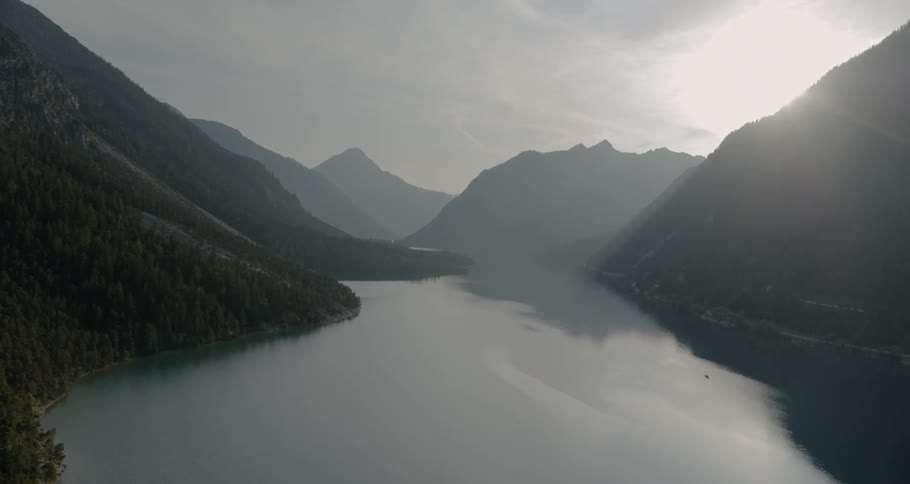 A large lake between mountains is shown