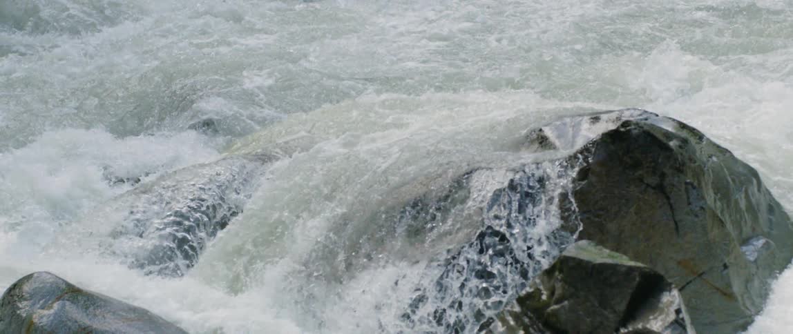 Waves crash against rocks