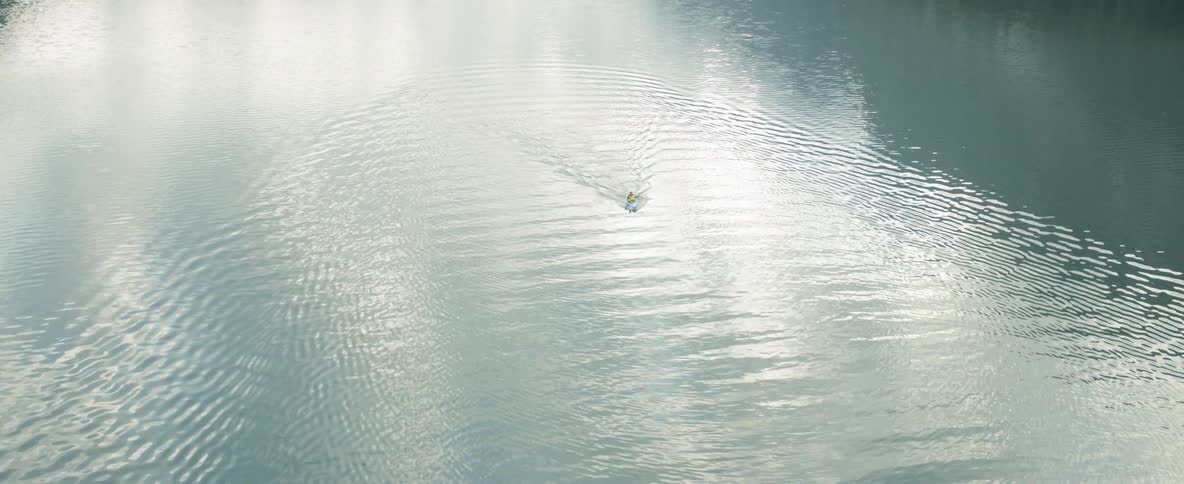 A boat that is sailing on a large river