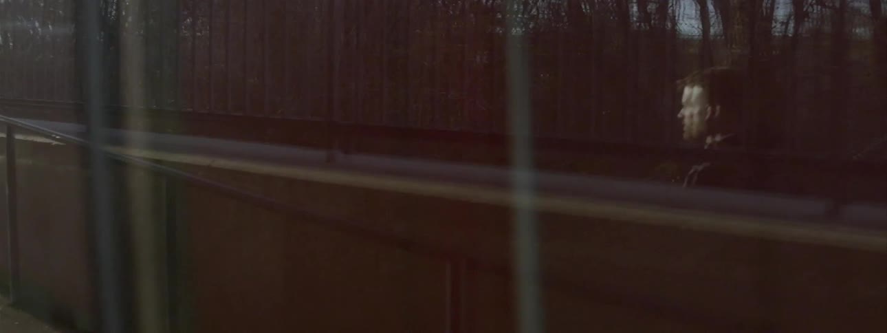 A person walking across a bridge