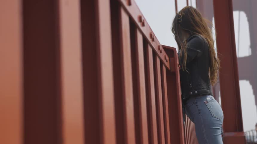 A woman posing on the golden gate bridge