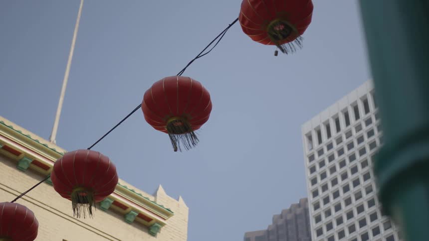 The camera looks up at chinese lanterns