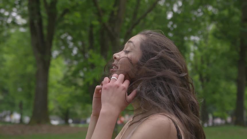 Woman brushes down hair