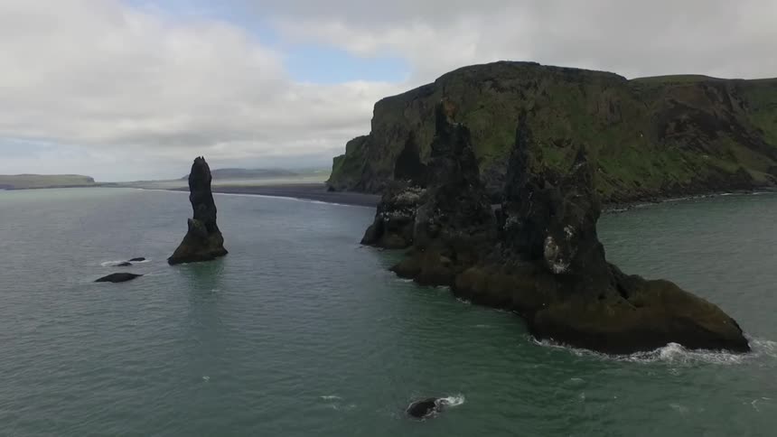 Rock formations jut out of the ocean