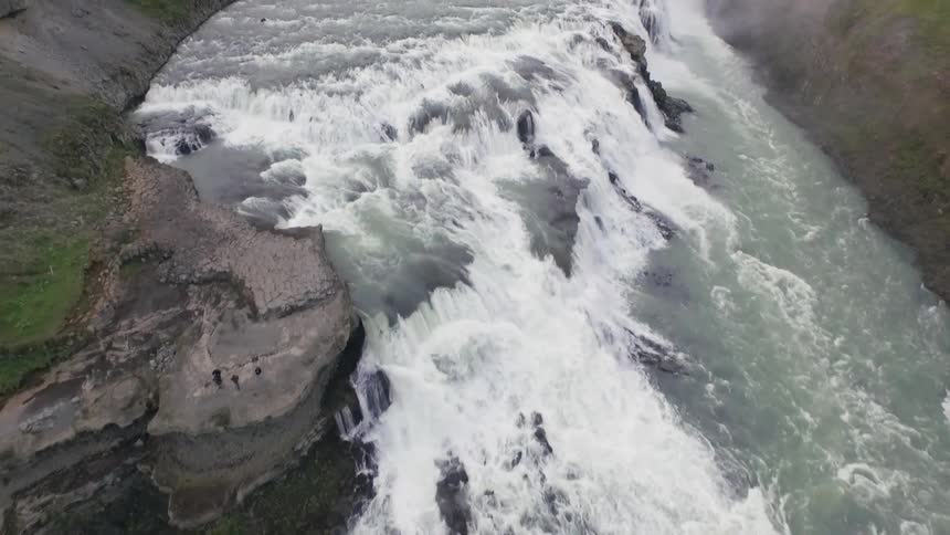 River water rushes and cascades over a rocky fall