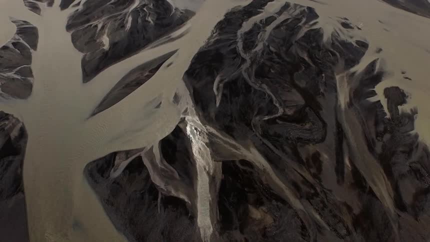 A vast river canal system runs through rock formations
