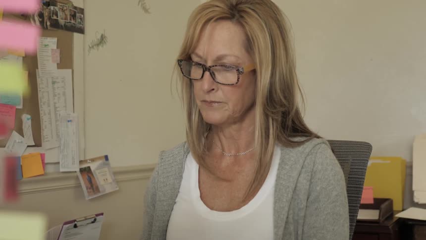 Woman flips through magazine