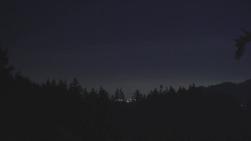 Lights are flashing in the horizon at night