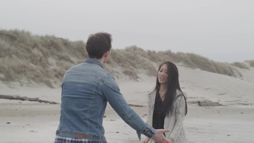 Two people are sad on the beach