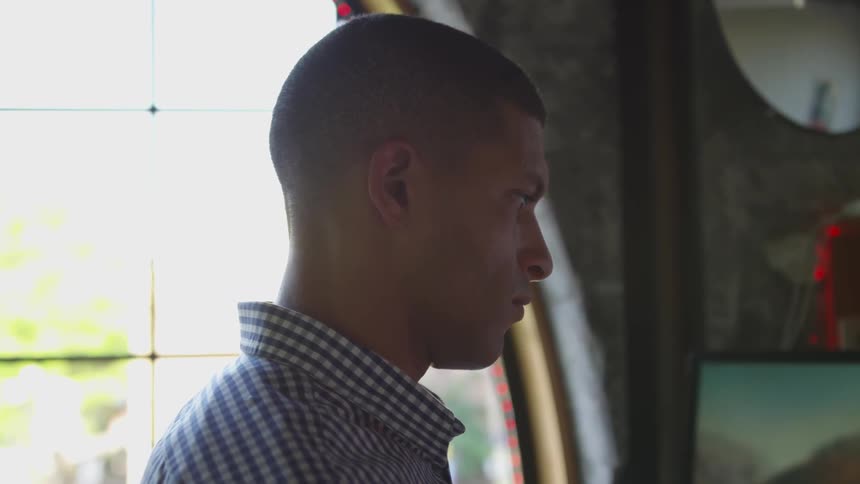 A young man looks ahead
