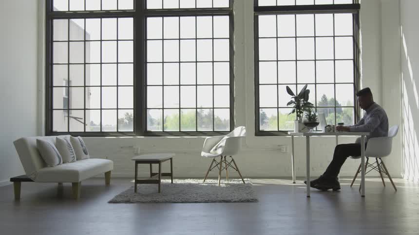 A man sits at a desk